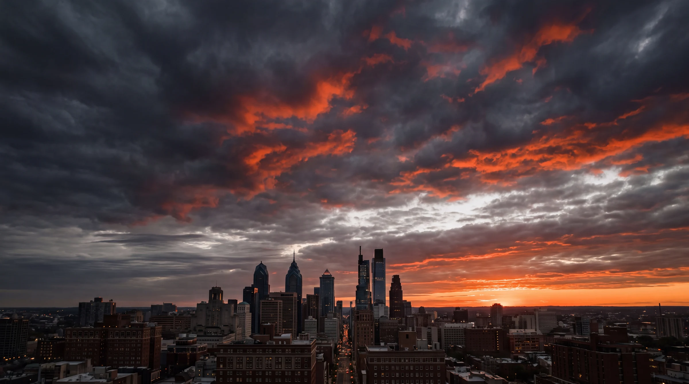 Orange dawn light over a city skyline